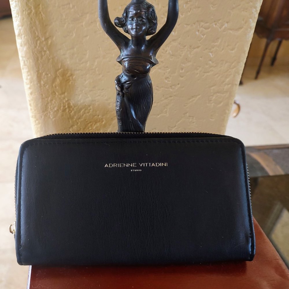 Adrienne Vittadini studio black wallet. 8"X4.5" faux leather, un-used.